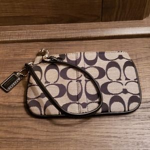 Gray and black Coach wristlet